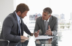 Two men at a meeting